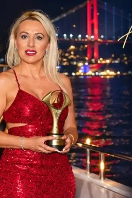 İlknur Tikici holding her award on the Bosphorus, Istanbul